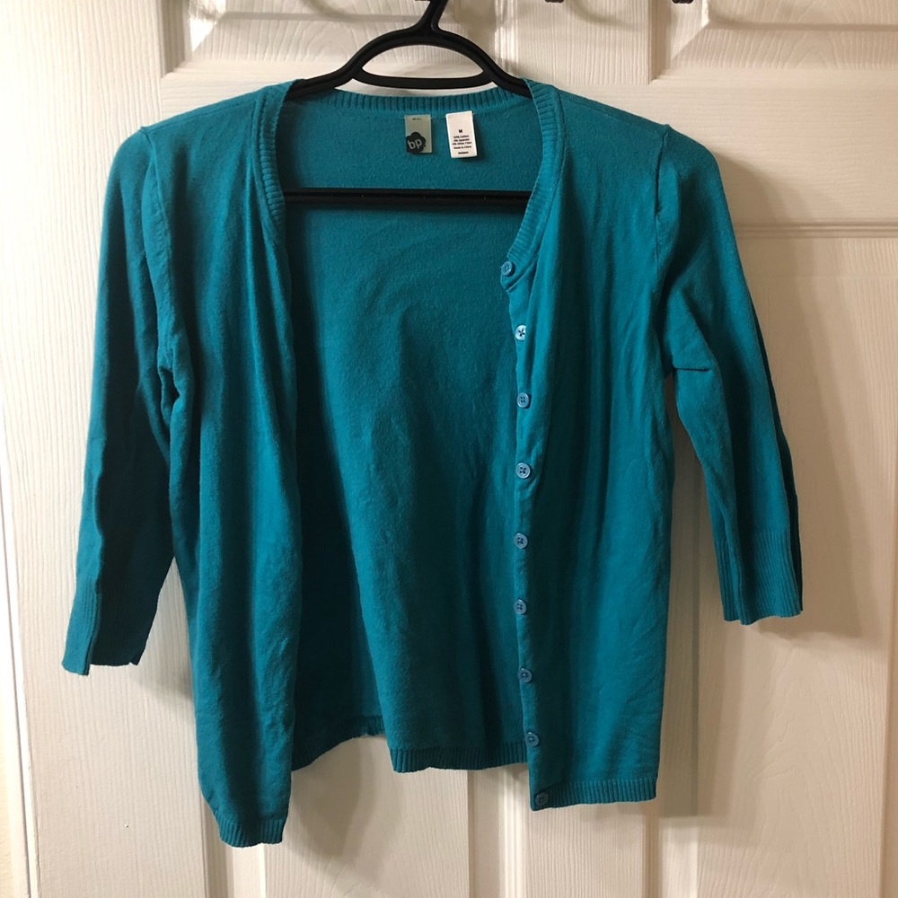 Turquoise crop cardigan, junior’s size medium.